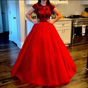 Ruby red Sherri Hill ball gown with included matching earrings.